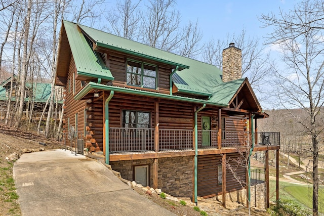 835 Rushing Water Trl, Rising Fawn, GA 30738 - back of house with a chimney, metal roof, log siding, and concrete driveway