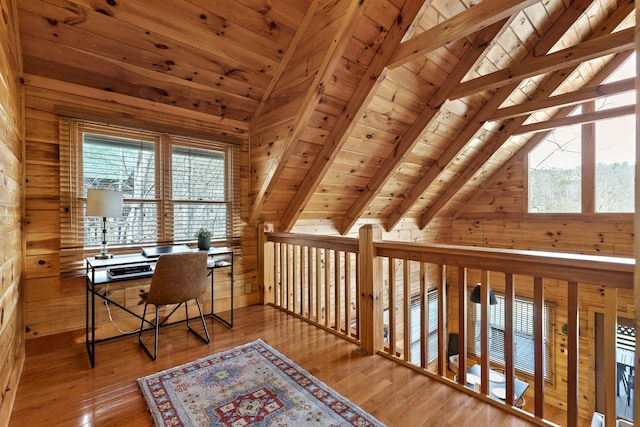 office with wood ceiling, wood walls, light hardwood / wood-style flooring, and plenty of natural light