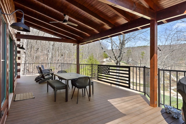 wooden deck featuring ceiling fan