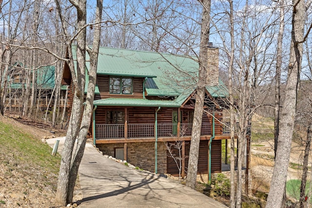 835 Rushing Water Trl, Rising Fawn, GA 30738 - rear view of property with metal roof, a chimney, asphalt driveway, a deck, and stone siding