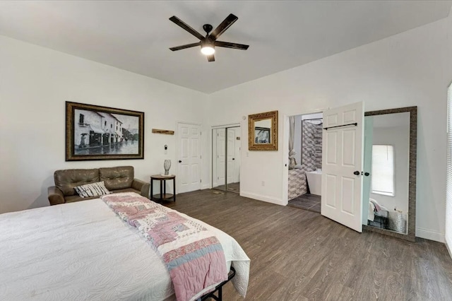 bedroom featuring ceiling fan, ensuite bath, and dark hardwood / wood-style flooring