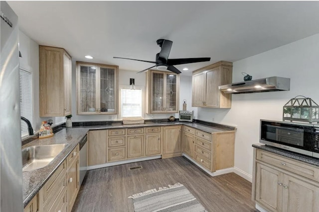 kitchen with dark hardwood / wood-style flooring, ceiling fan, light brown cabinetry, and extractor fan