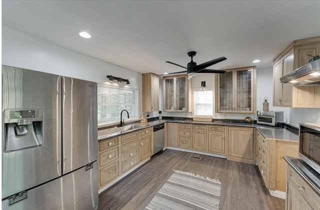 kitchen with dark hardwood / wood-style floors, sink, appliances with stainless steel finishes, ceiling fan, and light brown cabinetry