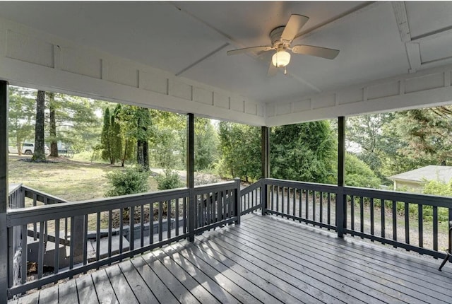 wooden terrace featuring ceiling fan