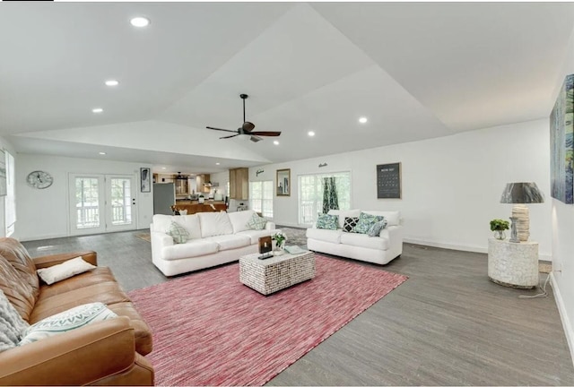 living room featuring wood-type flooring, lofted ceiling, ceiling fan, and french doors