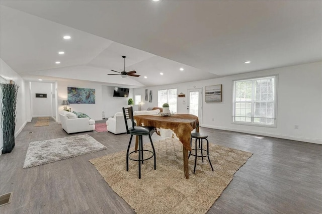 dining area featuring lofted ceiling, ceiling fan, and hardwood / wood-style flooring