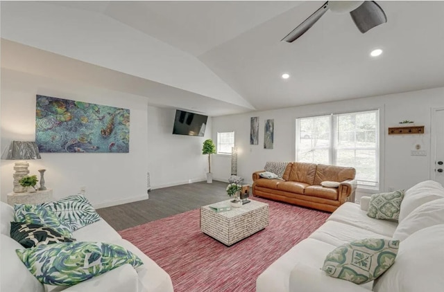 living room with vaulted ceiling, hardwood / wood-style floors, and ceiling fan