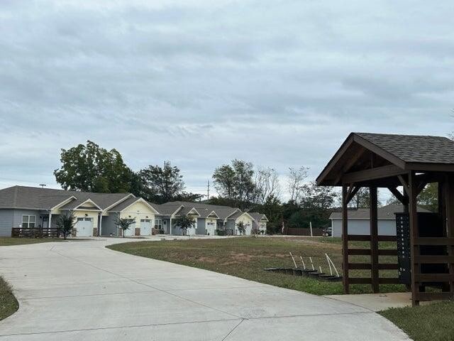 exterior space with a garage and a front lawn