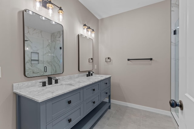 bathroom featuring a shower with door, vanity, and tile patterned flooring