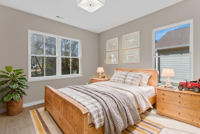 bedroom with light hardwood / wood-style flooring