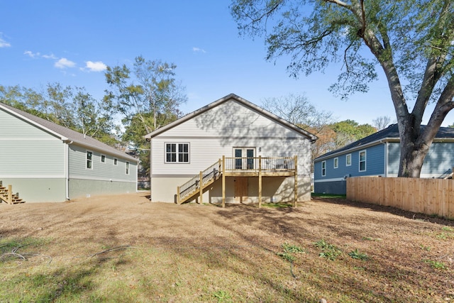 back of property featuring a wooden deck