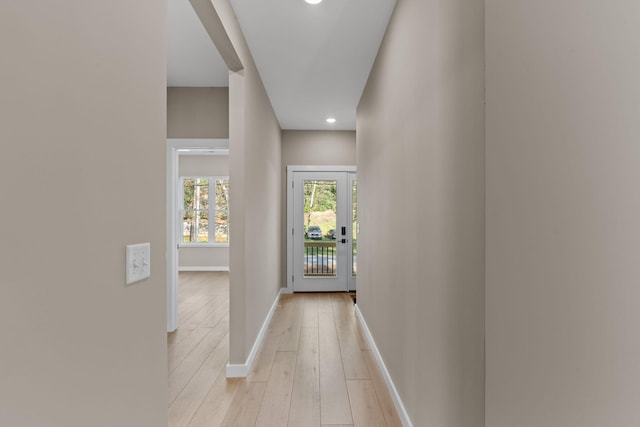 doorway to outside with light hardwood / wood-style floors