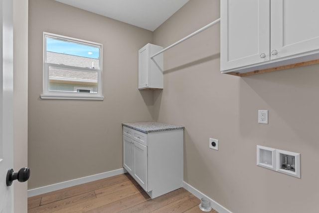 laundry area with cabinets, hookup for a washing machine, light hardwood / wood-style floors, and electric dryer hookup