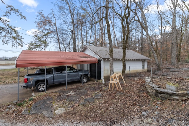 view of home's exterior featuring a carport