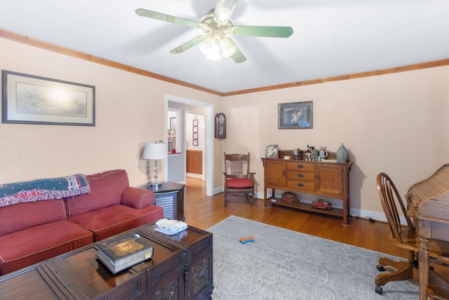 living room with ornamental molding, ceiling fan, and hardwood / wood-style flooring