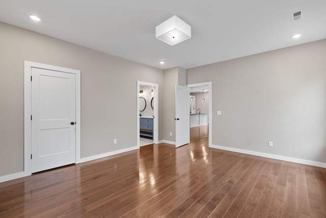 unfurnished room with hardwood / wood-style floors