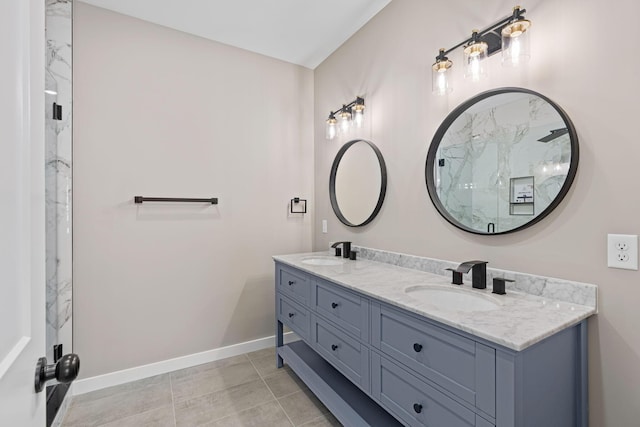 bathroom featuring tile patterned flooring, vanity, and an enclosed shower