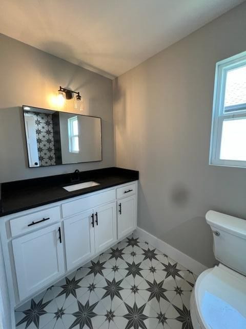 bathroom with vanity and toilet