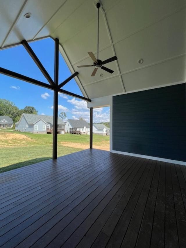 wooden deck with ceiling fan and a yard