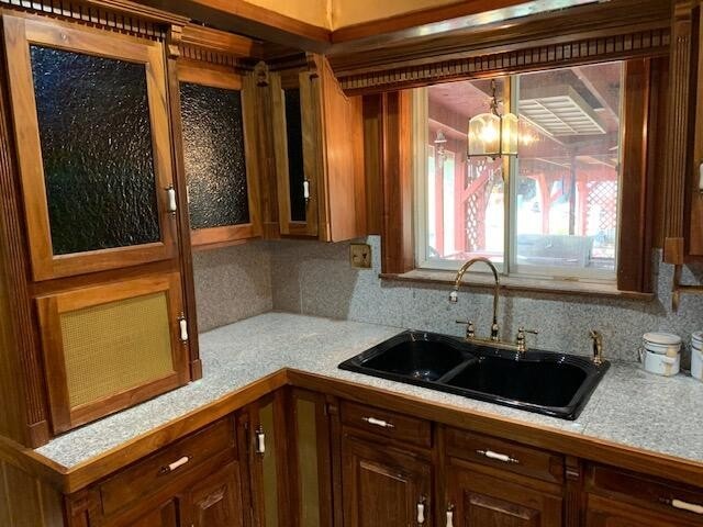 kitchen featuring backsplash and sink