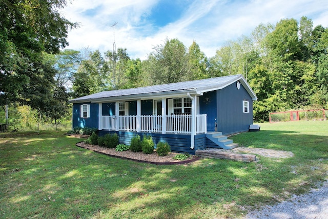 single story home featuring a front yard and covered porch