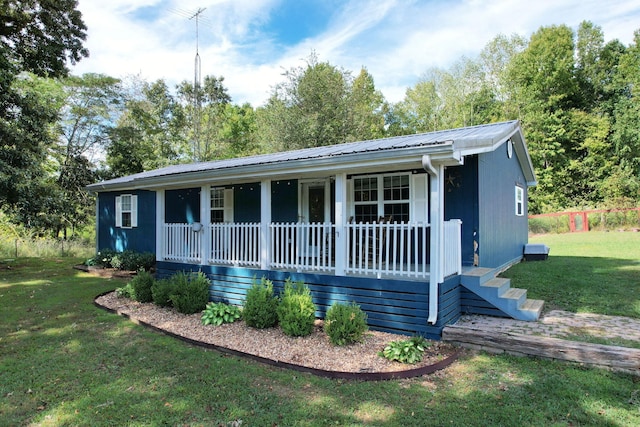 single story home with a front lawn and covered porch