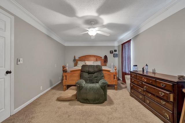 bedroom featuring a textured ceiling, carpet, crown molding, and ceiling fan