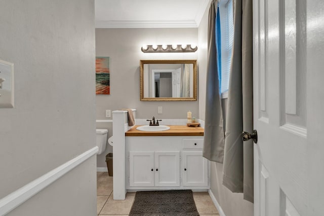 bathroom featuring ornamental molding, vanity, tile patterned flooring, and toilet