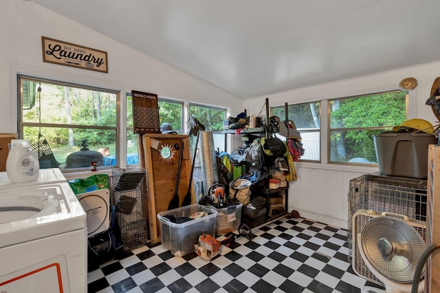 miscellaneous room featuring a wealth of natural light, lofted ceiling, and separate washer and dryer