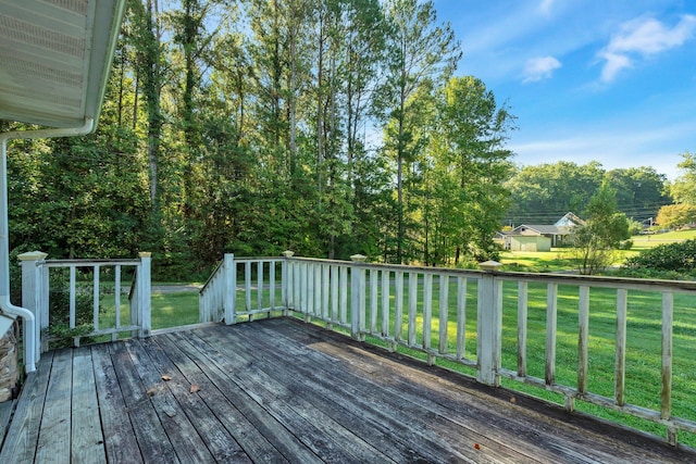 wooden terrace with a yard