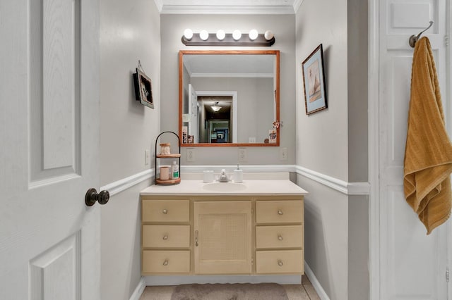 bathroom with ornamental molding, vanity, and tile patterned floors