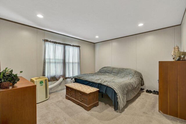 bedroom with light carpet and crown molding