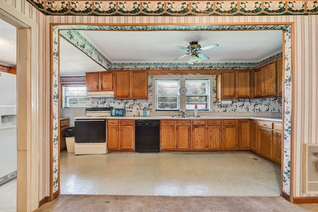 kitchen with ceiling fan, sink, heating unit, black dishwasher, and white range with electric stovetop