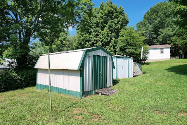 view of outbuilding with a yard