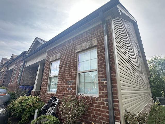 view of side of property featuring cooling unit