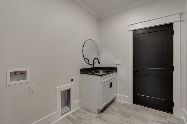 clothes washing area featuring hookup for an electric dryer, hookup for a washing machine, cabinets, ornamental molding, and sink