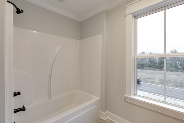 bathroom with shower / bath combination and ornamental molding