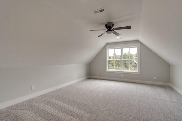 bonus room featuring lofted ceiling, carpet flooring, and ceiling fan