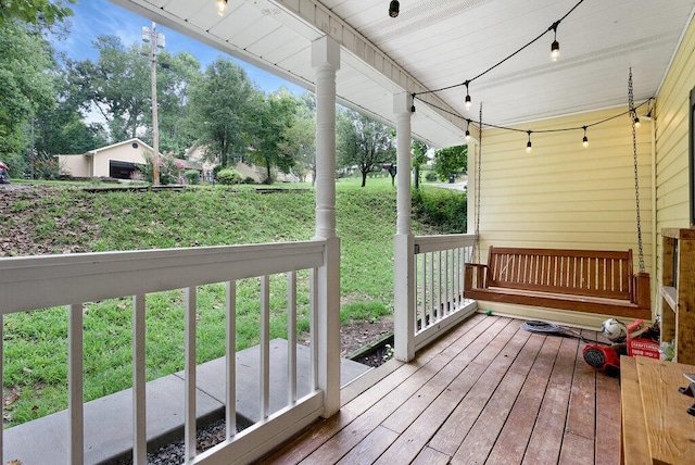 wooden deck featuring a yard