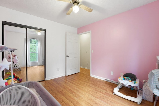 playroom featuring ceiling fan and light wood-type flooring