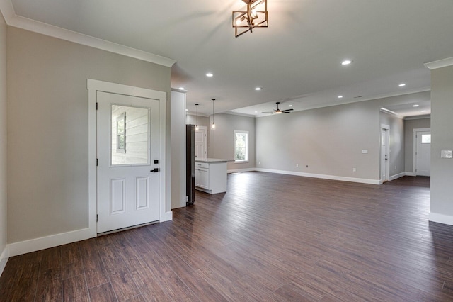 foyer entrance featuring ornamental molding, ceiling fan, and dark hardwood / wood-style flooring