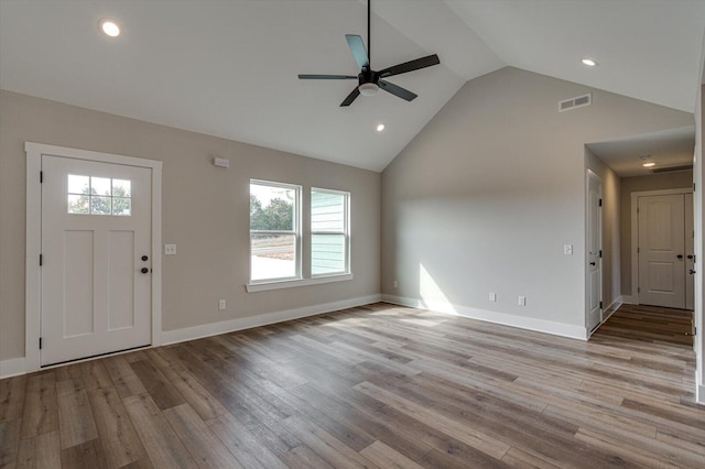 entrance foyer with high vaulted ceiling, ceiling fan, and light wood-type flooring