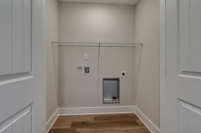 clothes washing area featuring hookup for a washing machine, wood-type flooring, and hookup for an electric dryer