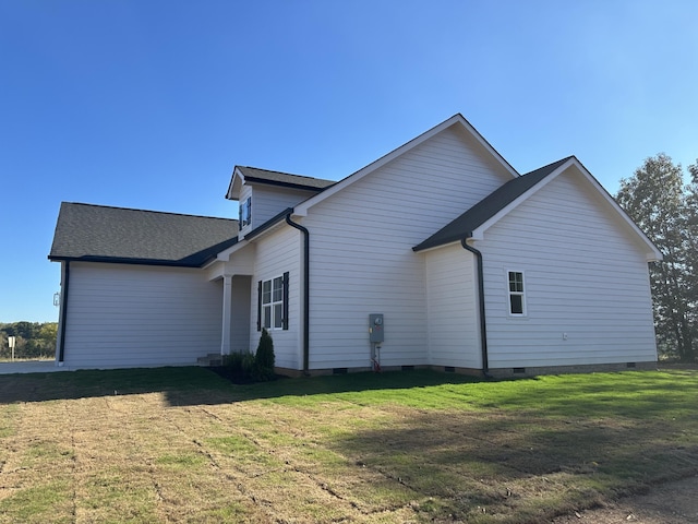 view of property exterior with a lawn