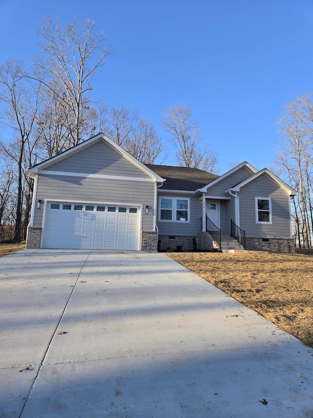 ranch-style house featuring a garage