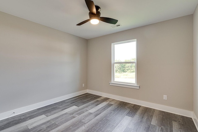 unfurnished room with ceiling fan and hardwood / wood-style flooring