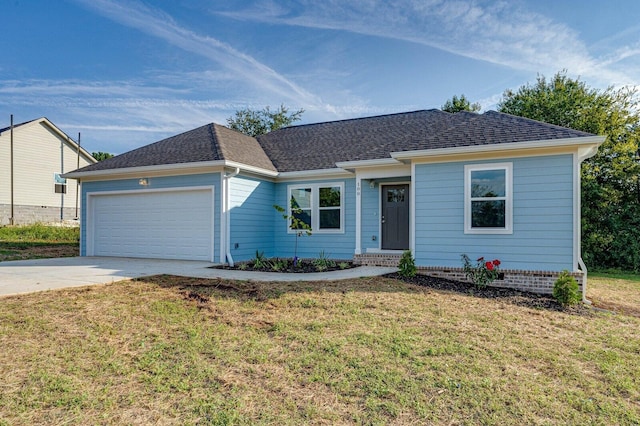 ranch-style house featuring a front lawn and a garage