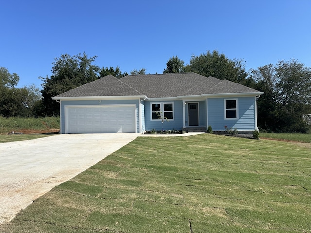 ranch-style house with a garage and a front yard