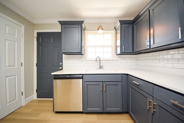 kitchen with ornamental molding, sink, stainless steel dishwasher, backsplash, and light hardwood / wood-style floors