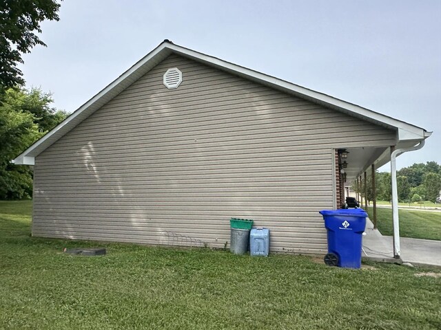 view of property exterior with a lawn